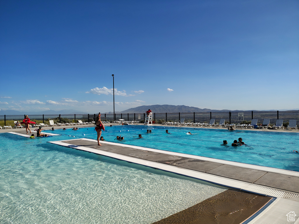 Community pool with a mountain view