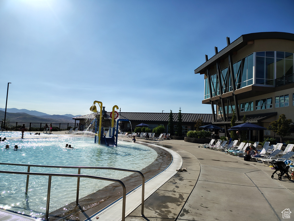 View of pool with a mountain view