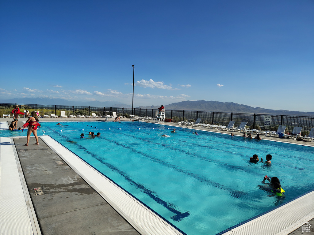Community pool with a mountain view
