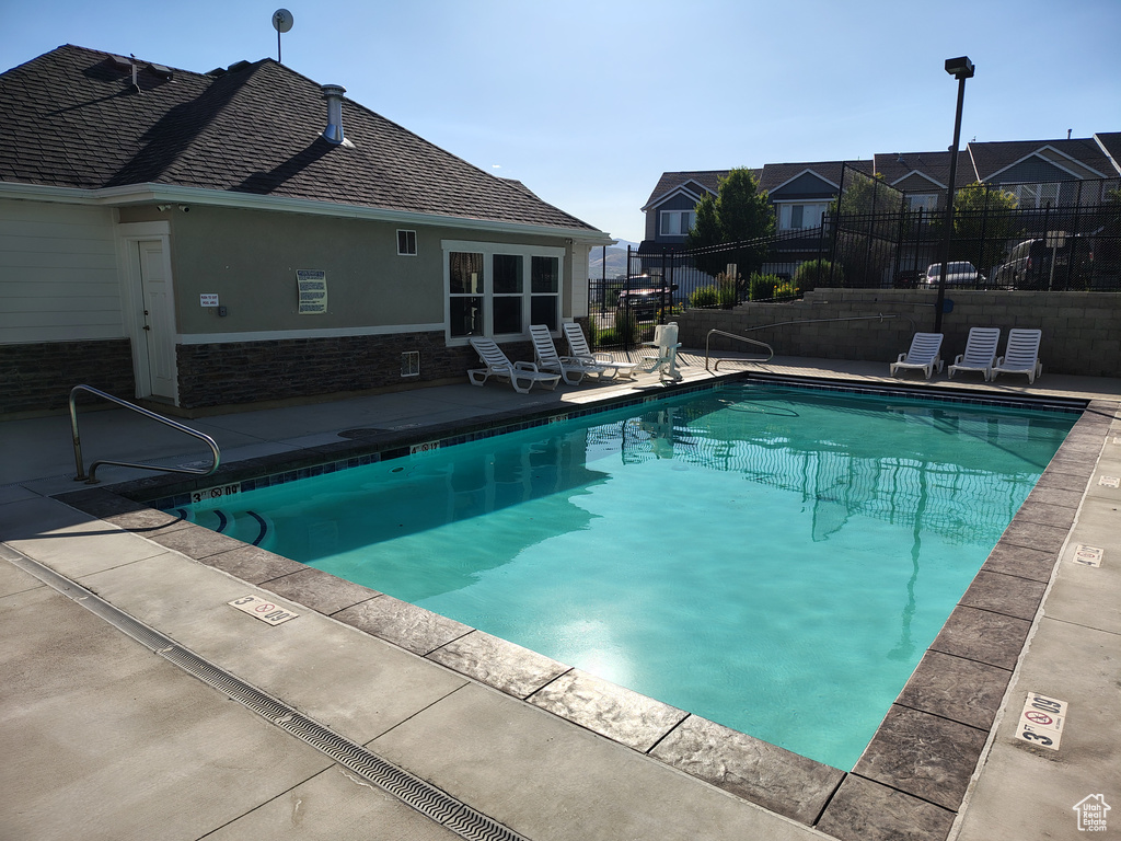 Community pool with a patio area