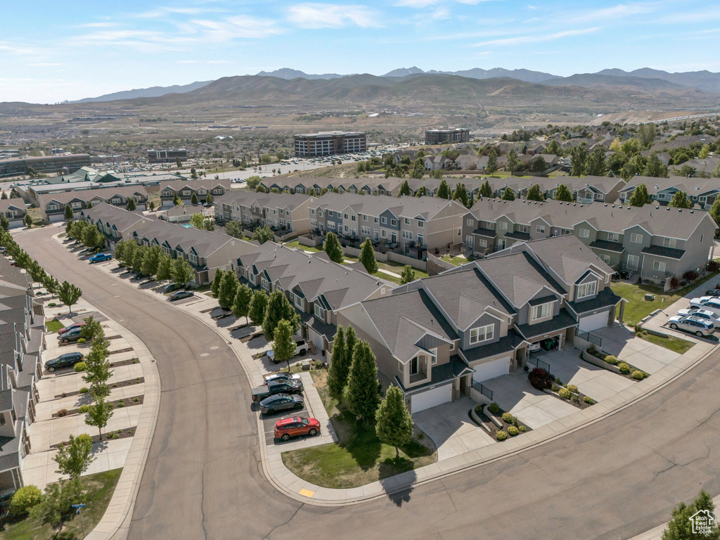 Aerial view of residential area featuring a mountain backdrop