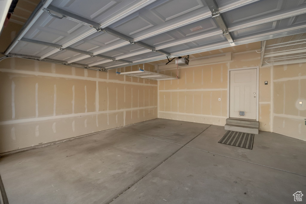 Garage featuring a garage door opener