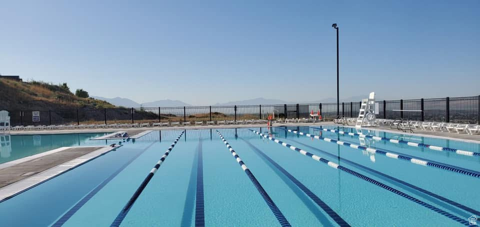 Community pool with a mountain view