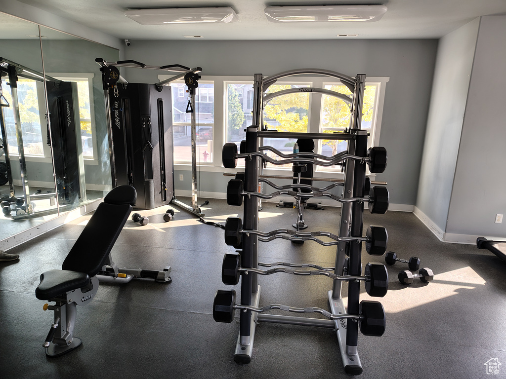 Workout area featuring baseboards