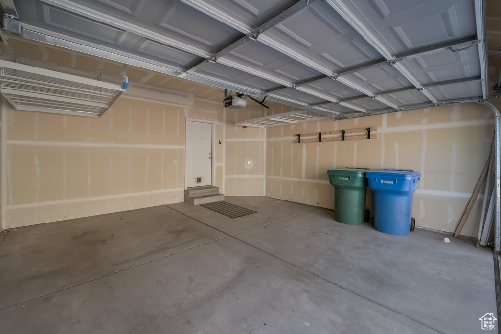 Garage featuring a garage door opener