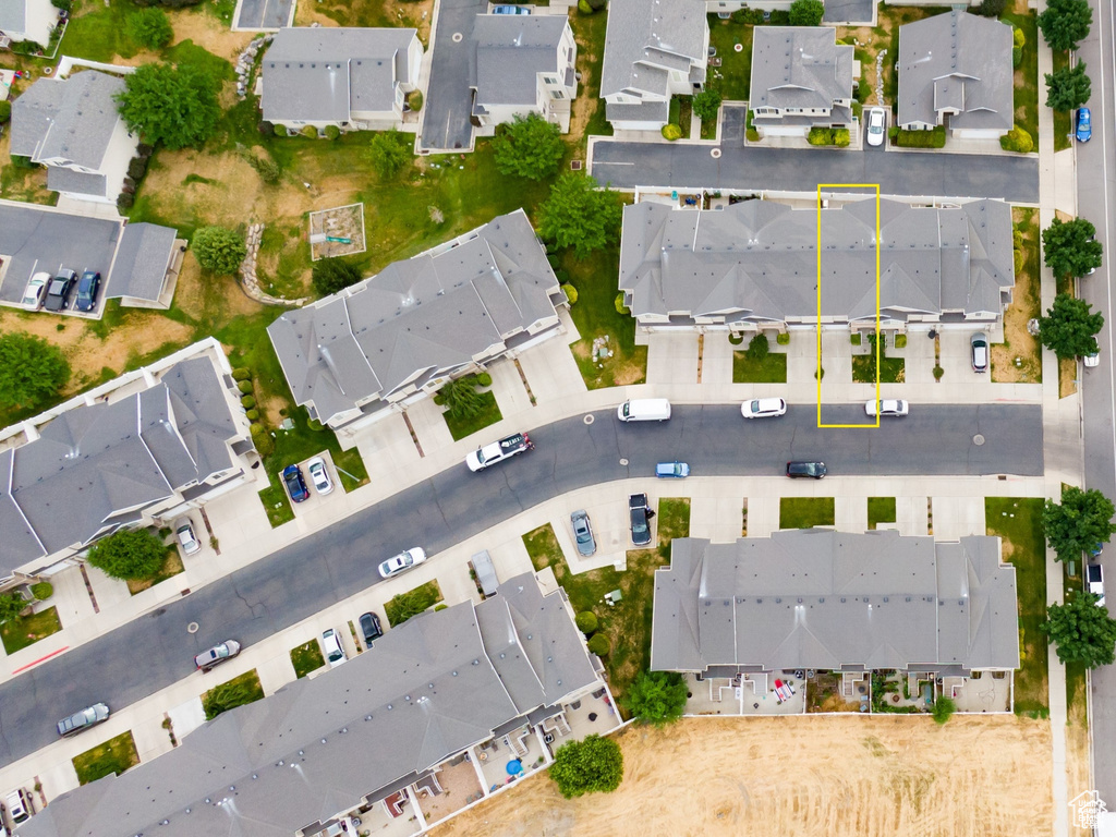 Aerial view of property and surrounding area with nearby suburban area and property parcel outlined