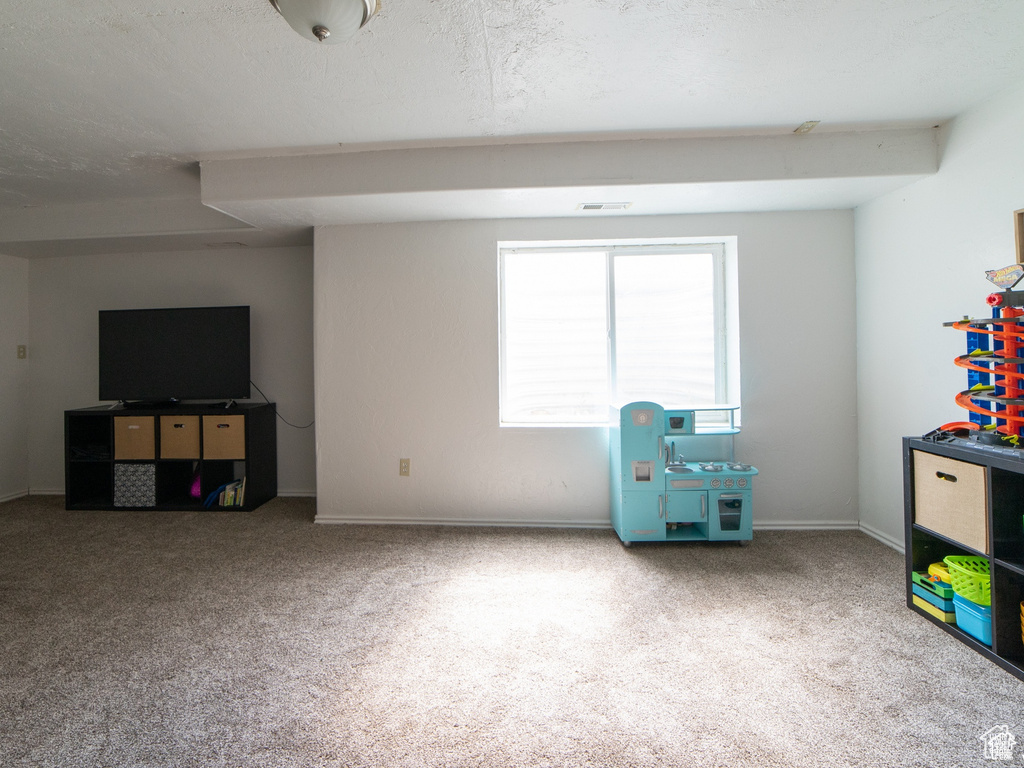 Game room featuring carpet flooring and baseboards
