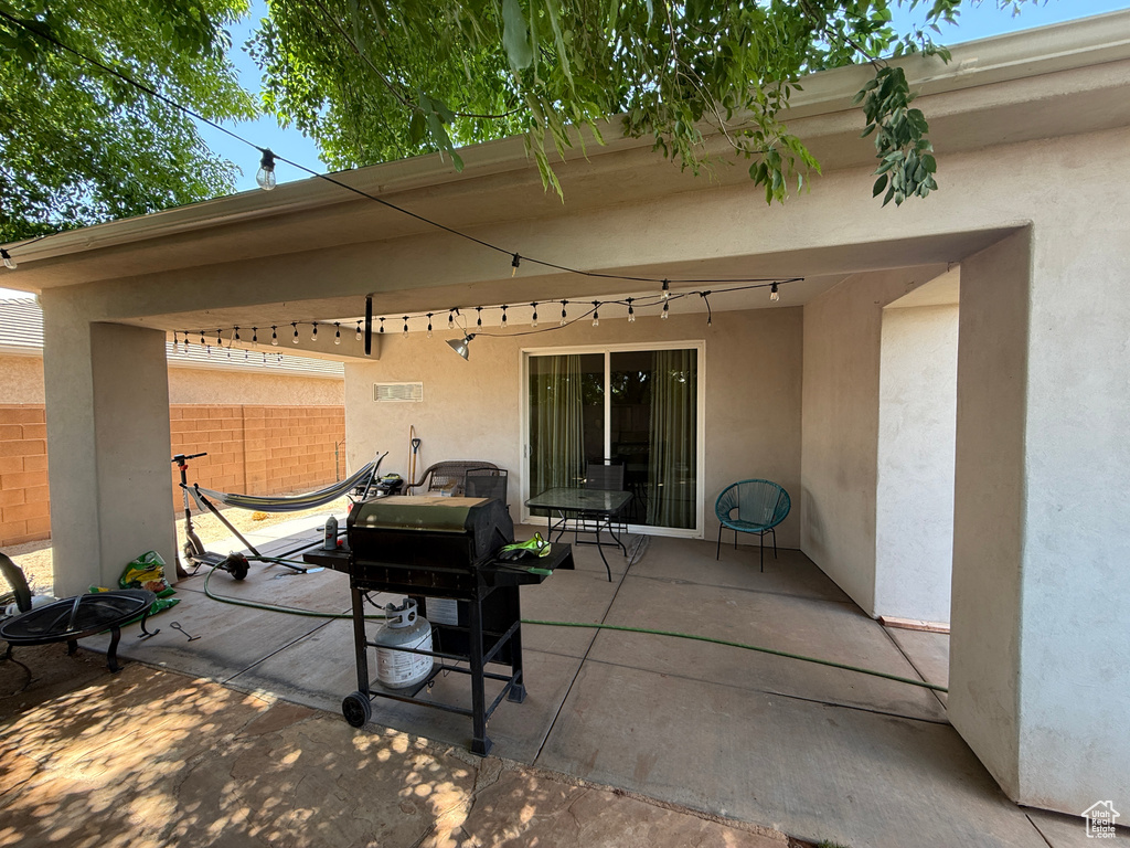 View of patio featuring a grill