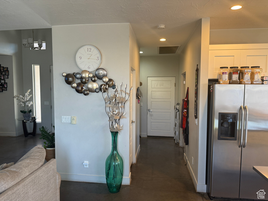 Hall with recessed lighting and baseboards