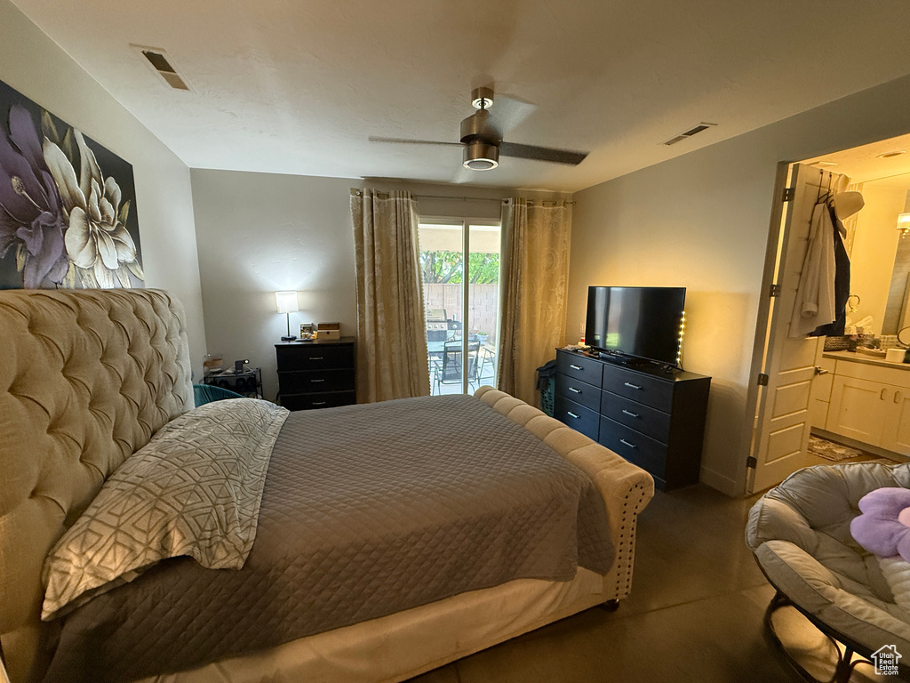 Carpeted bedroom featuring access to outside and ceiling fan