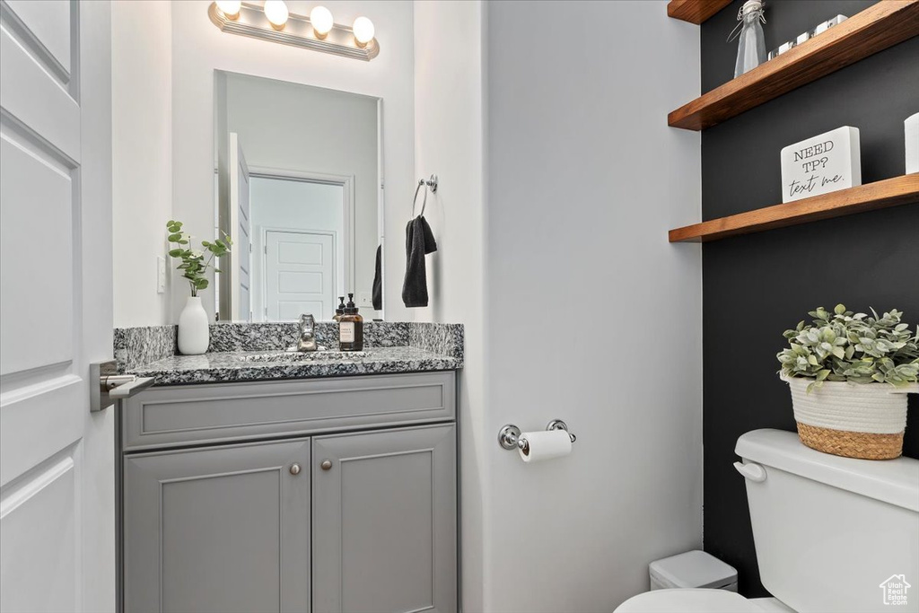 Bathroom with toilet and vanity