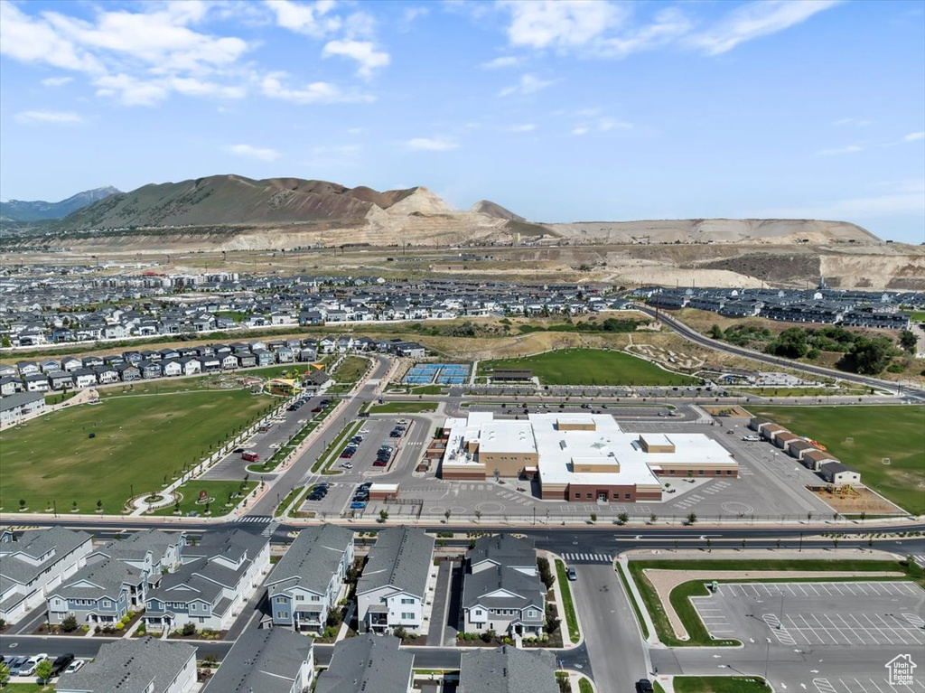 View of property location featuring a mountain backdrop and nearby suburban area