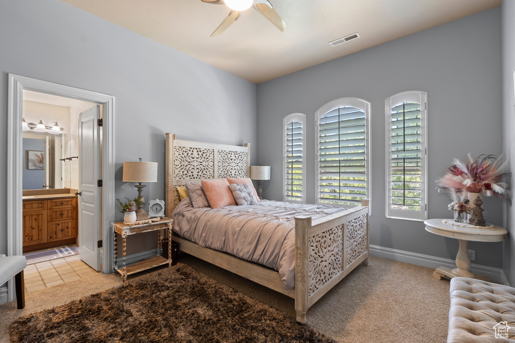 Bedroom featuring connected bathroom, a ceiling fan, and baseboards