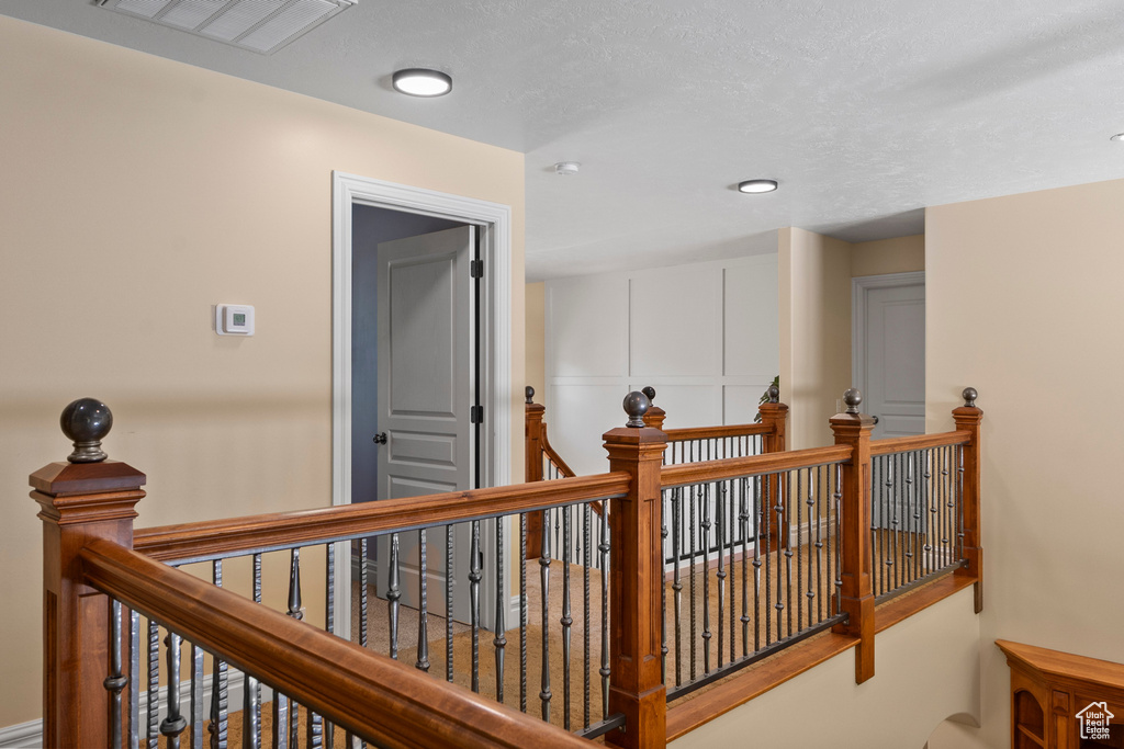 Hallway with an upstairs landing