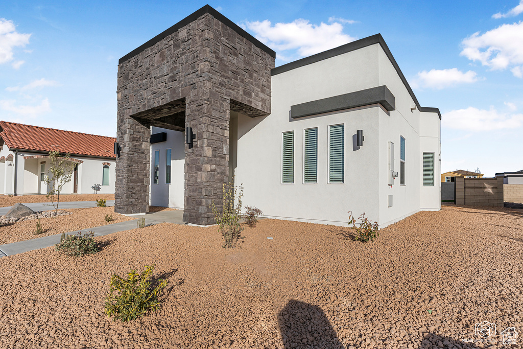 Contemporary home featuring stucco siding