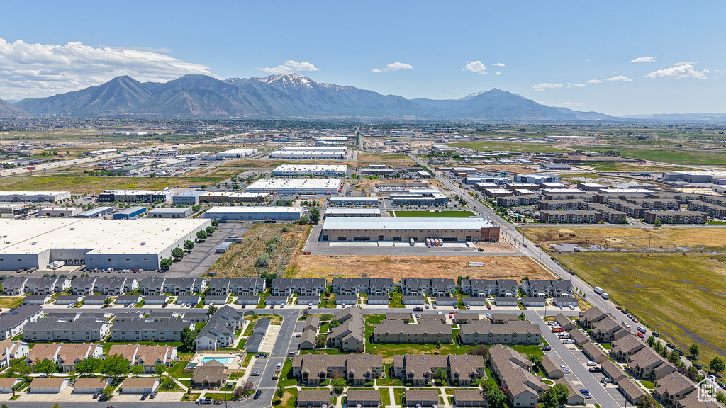 Aerial view of property and surrounding area featuring mountains