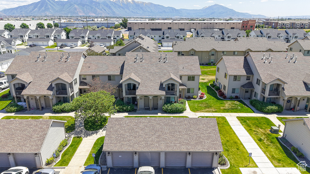 Aerial view of residential area featuring mountains