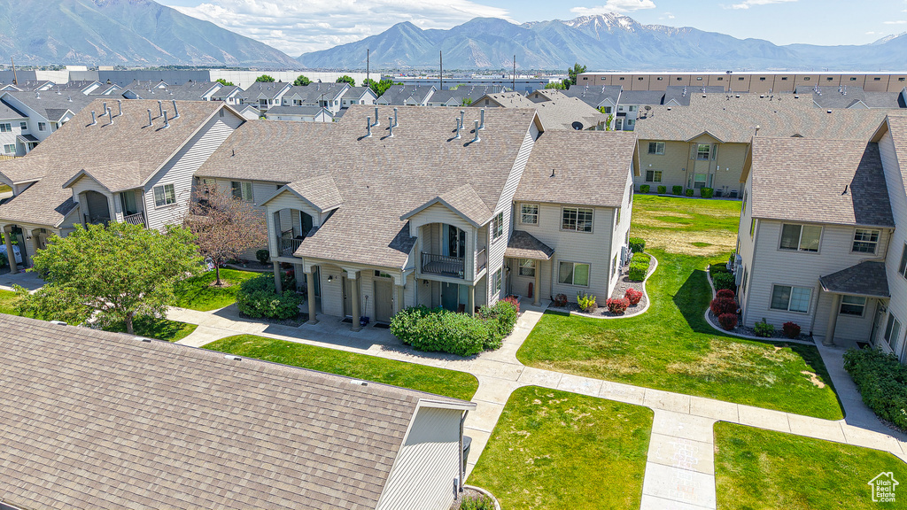 Aerial perspective of suburban area with a mountain backdrop