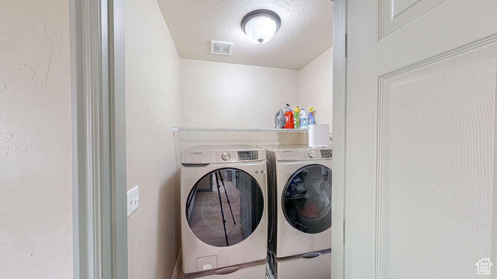 Laundry area featuring washer and clothes dryer