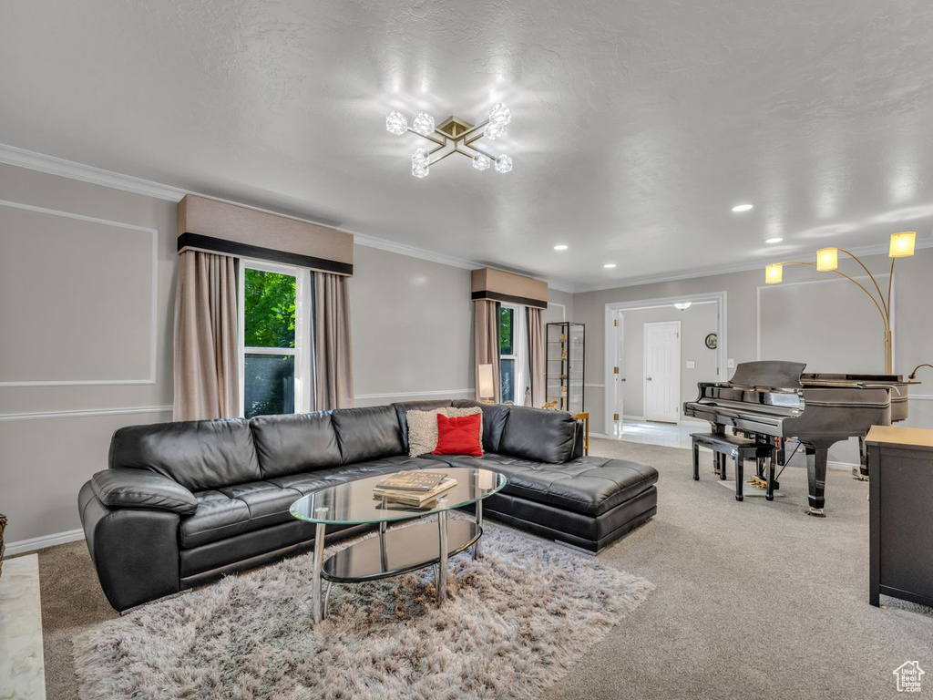 Living area featuring ornamental molding, light carpet, baseboards, and recessed lighting