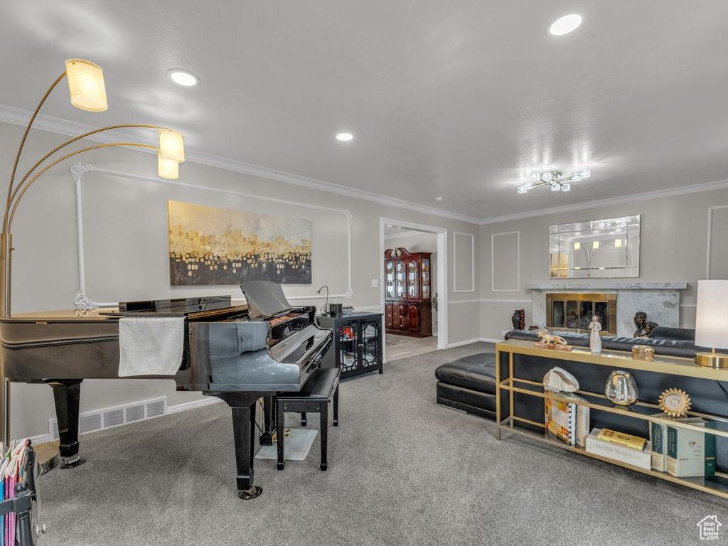 Dining space with crown molding, carpet flooring, a fireplace, and recessed lighting