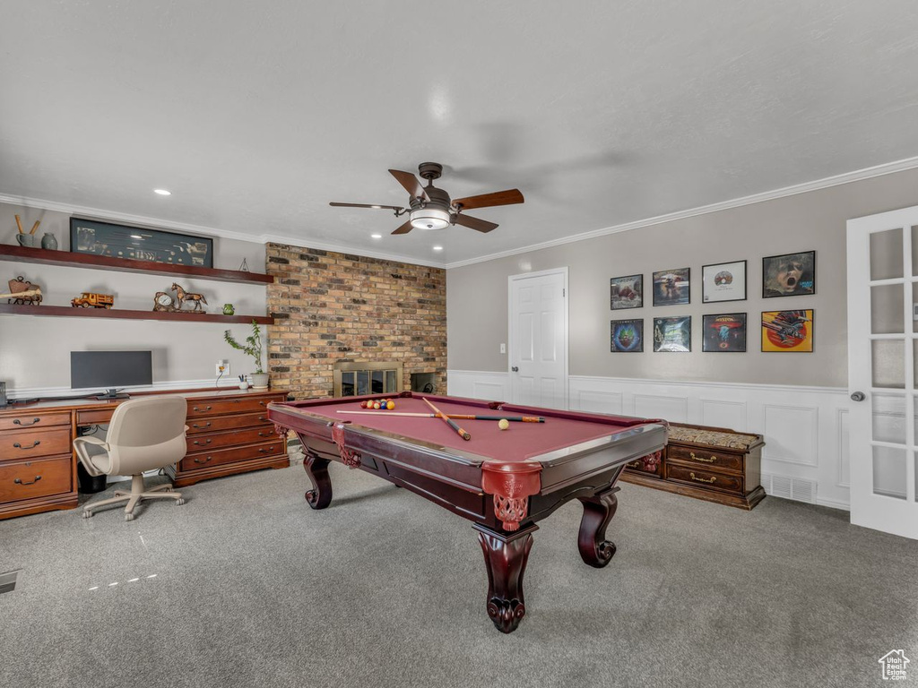 Playroom with crown molding, carpet, ceiling fan, billiards, and a wainscoted wall