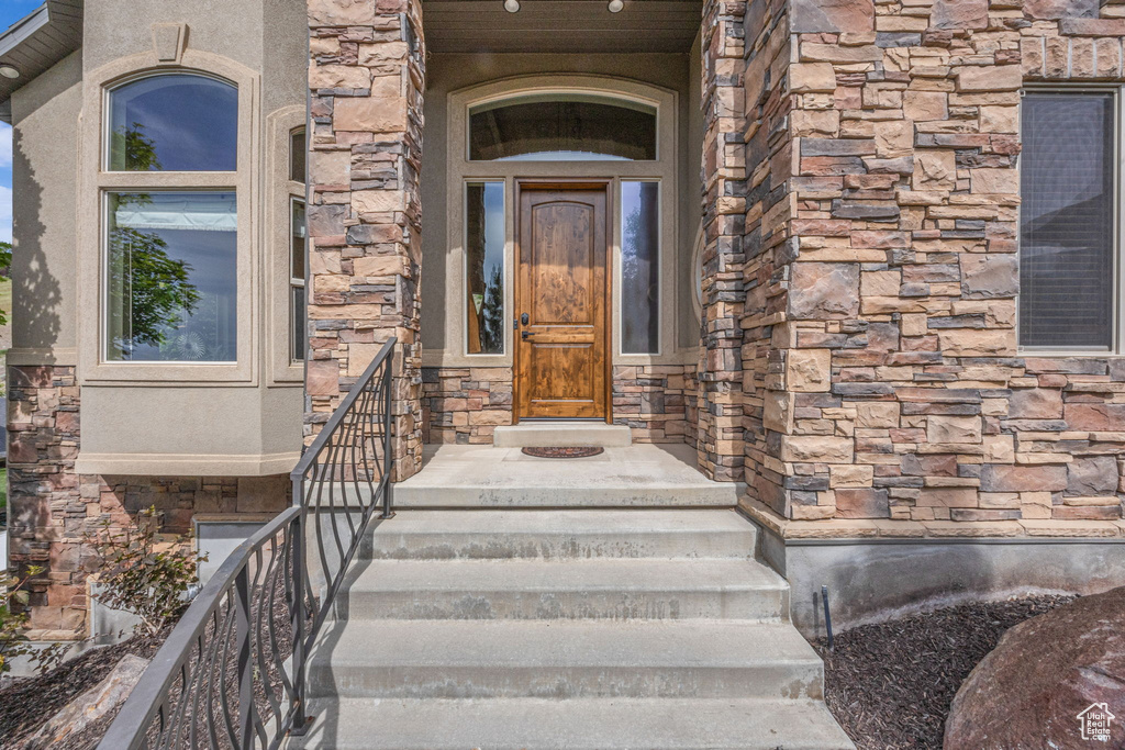 Property entrance featuring stone siding