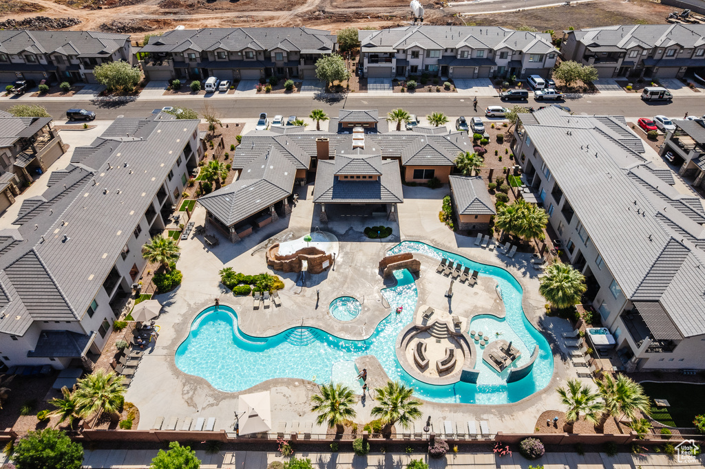 Aerial view of residential area featuring a pool