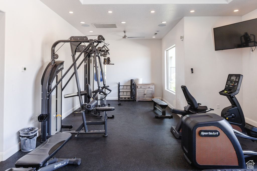 Exercise room featuring recessed lighting, baseboards, and a ceiling fan