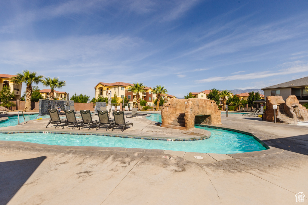 Community pool featuring a residential view and a patio