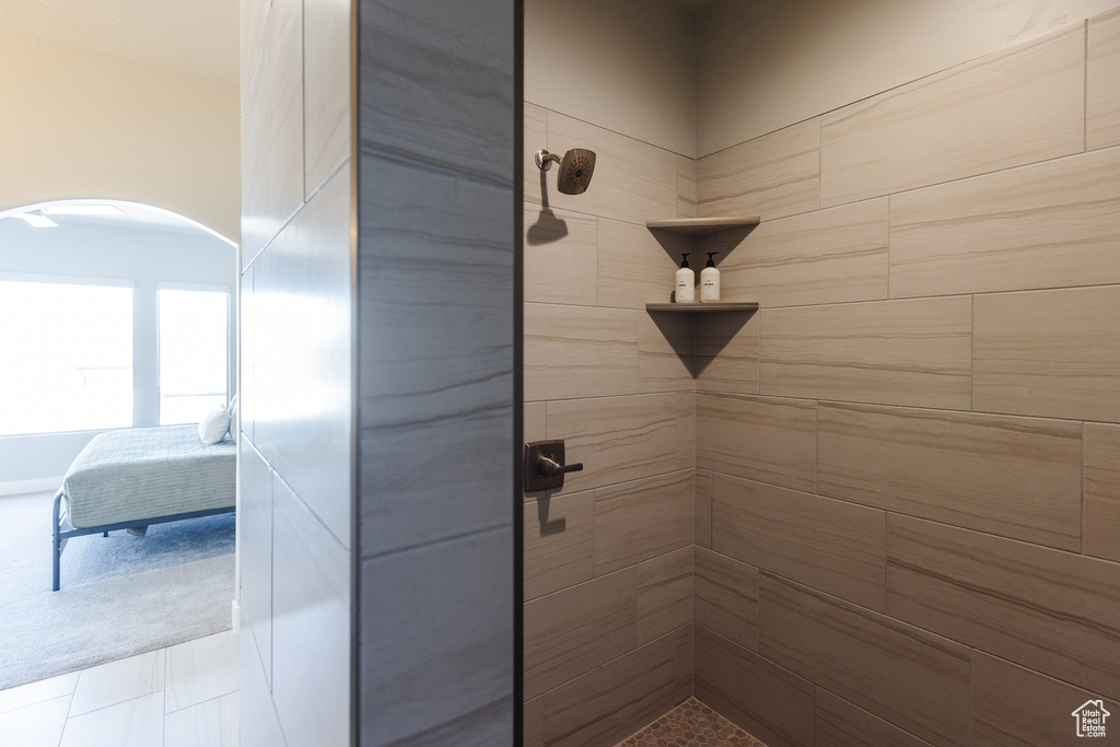 Ensuite bathroom with a tile shower