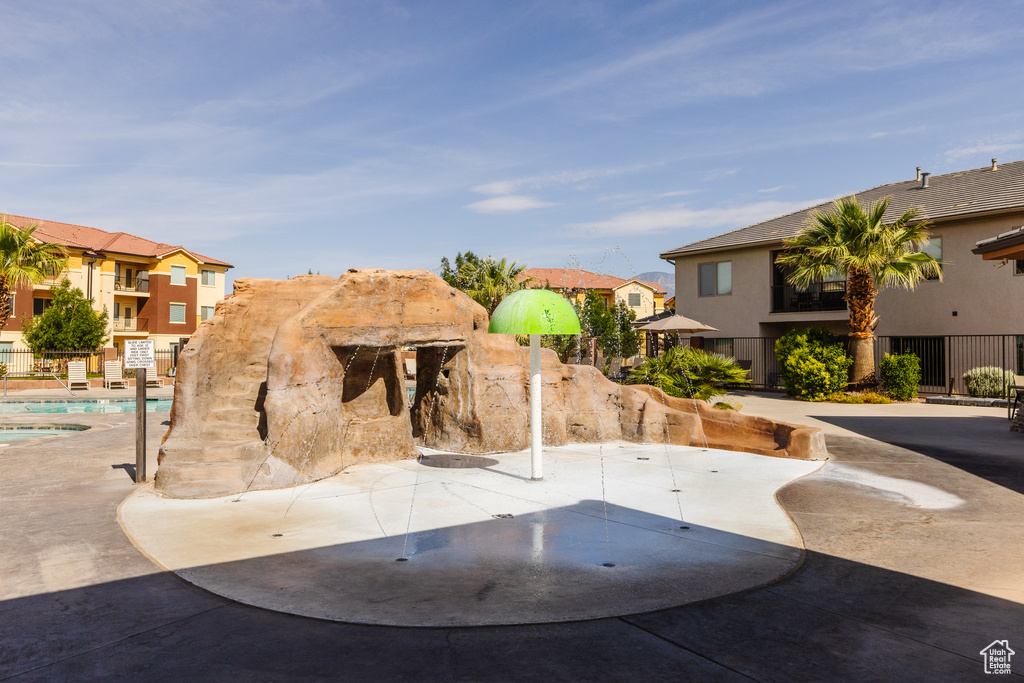 Surrounding community with a residential view and a swimming pool