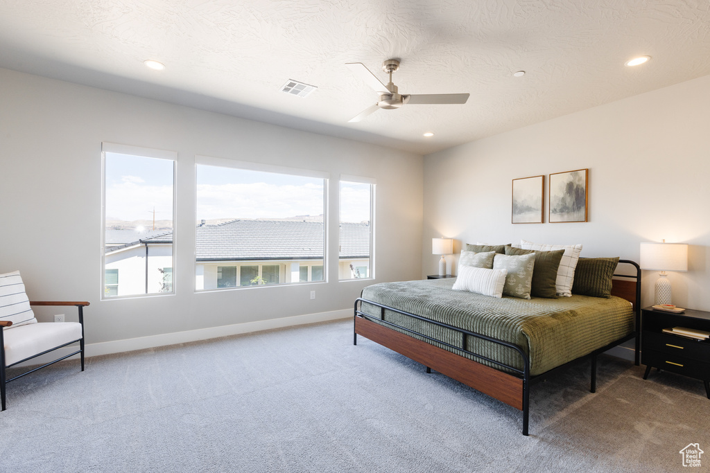 Bedroom featuring carpet flooring, baseboards, recessed lighting, and ceiling fan