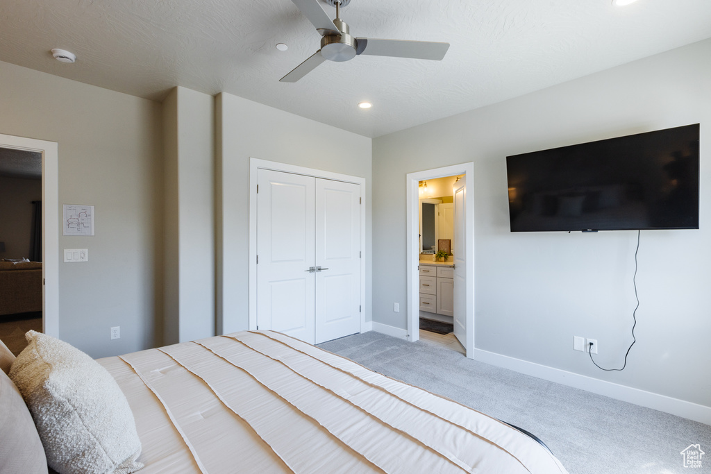 Bedroom featuring light colored carpet, baseboards, recessed lighting, a closet, and ceiling fan