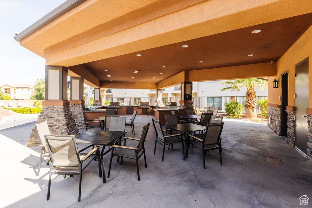 View of patio featuring outdoor dining space and an outdoor kitchen