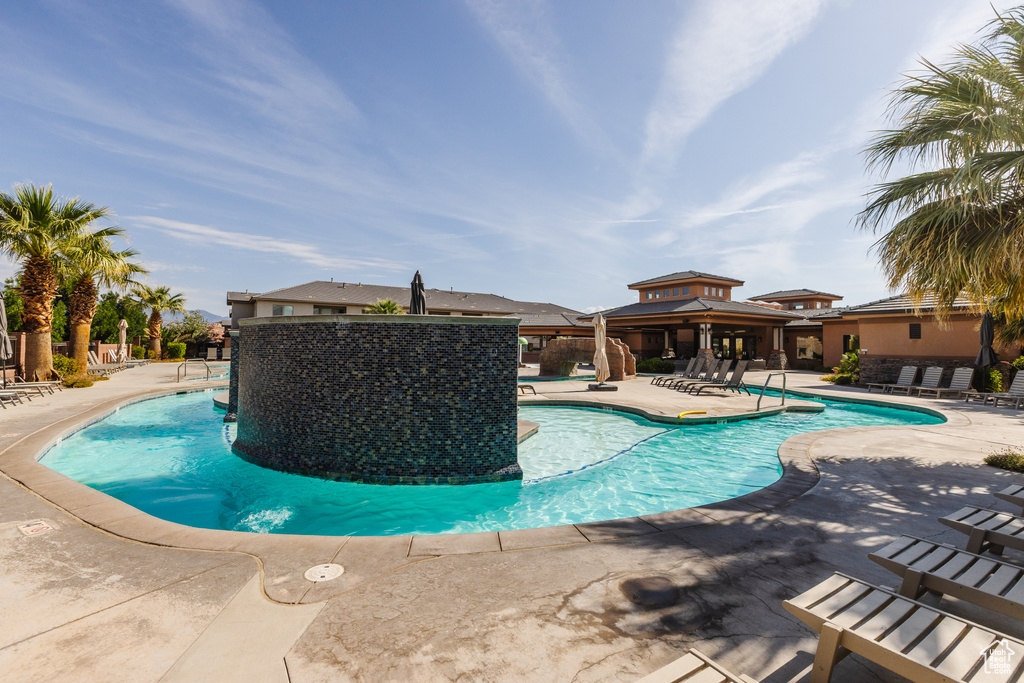 Community pool featuring a patio area