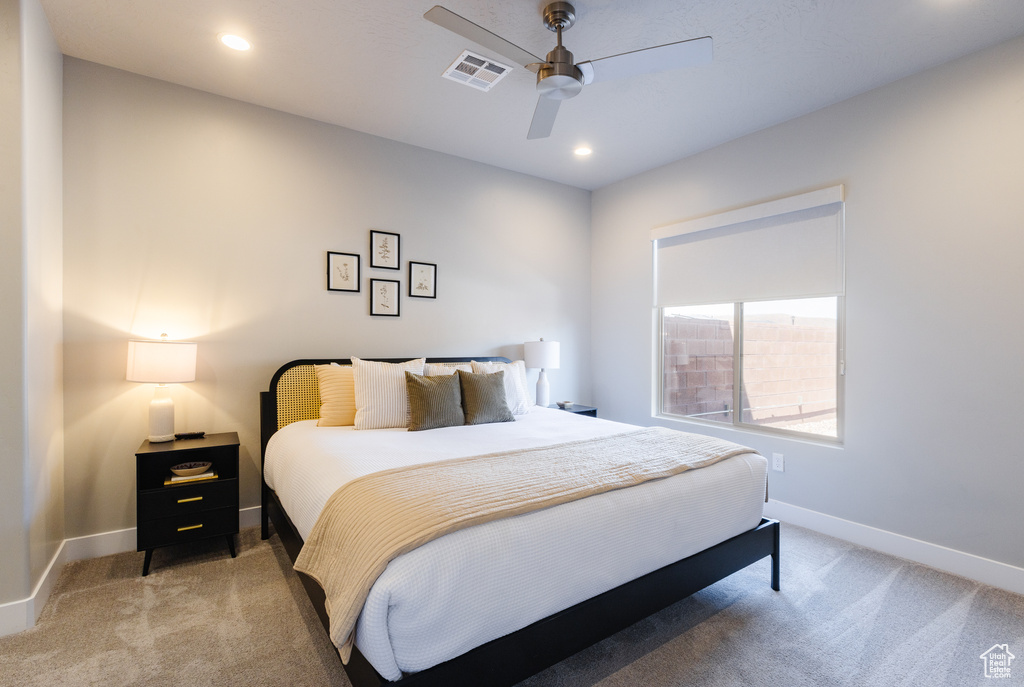 Bedroom featuring light carpet, baseboards, a ceiling fan, and recessed lighting