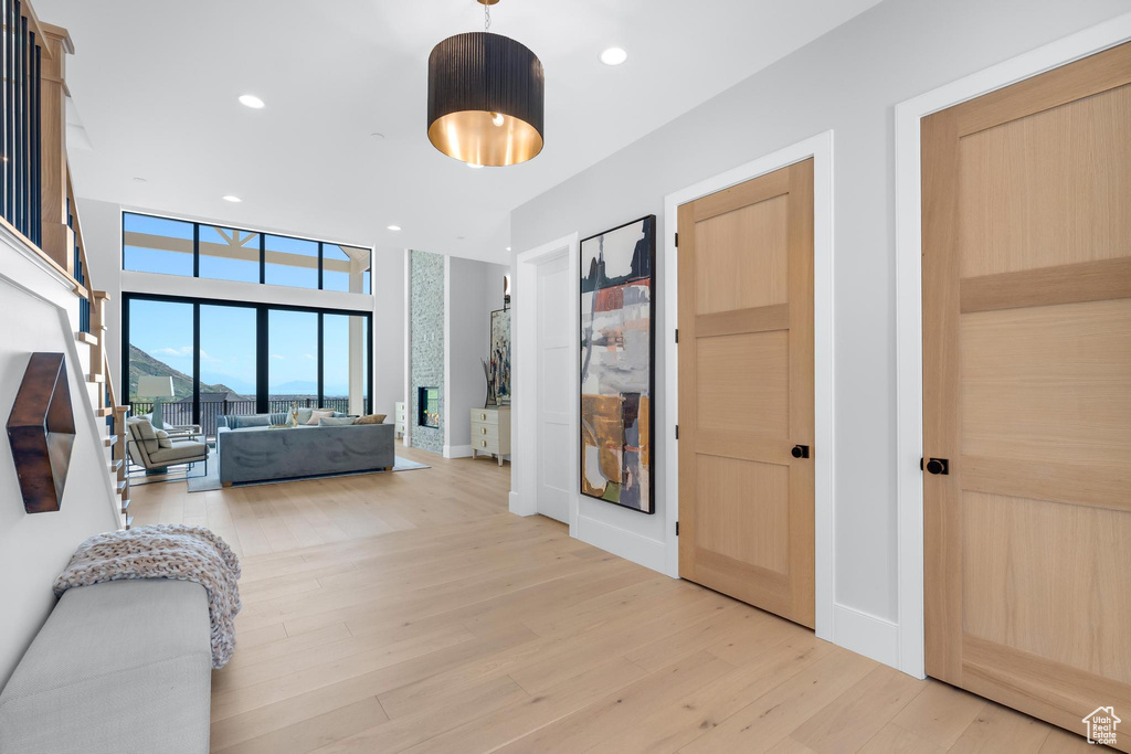Bedroom with light wood finished floors and recessed lighting