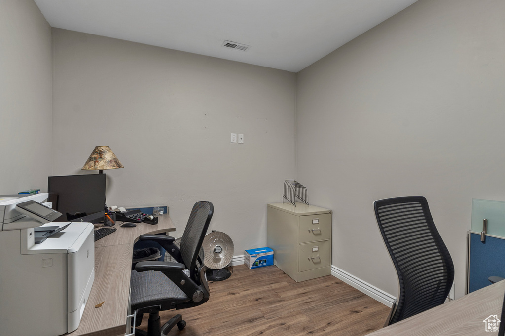 Office area featuring wood finished floors and baseboards