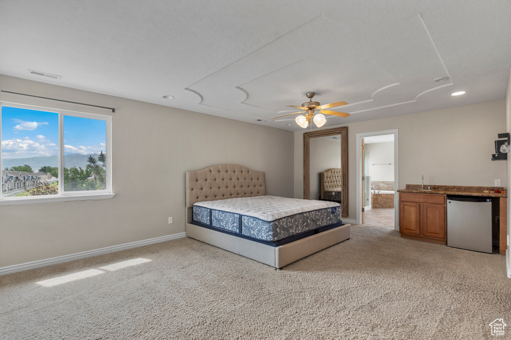 Bedroom with light carpet, recessed lighting, a sink, baseboards, and ceiling fan