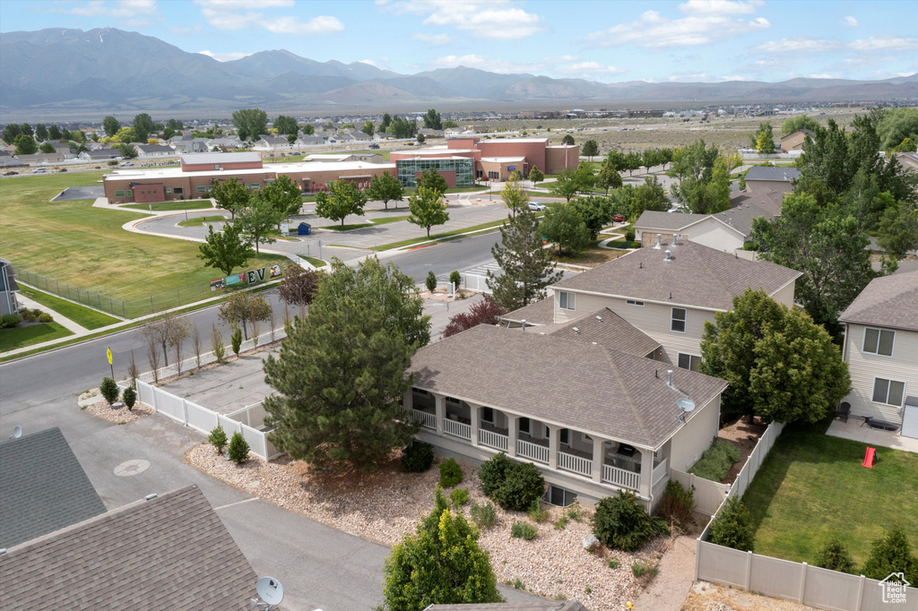 Aerial view of residential area featuring a mountainous background