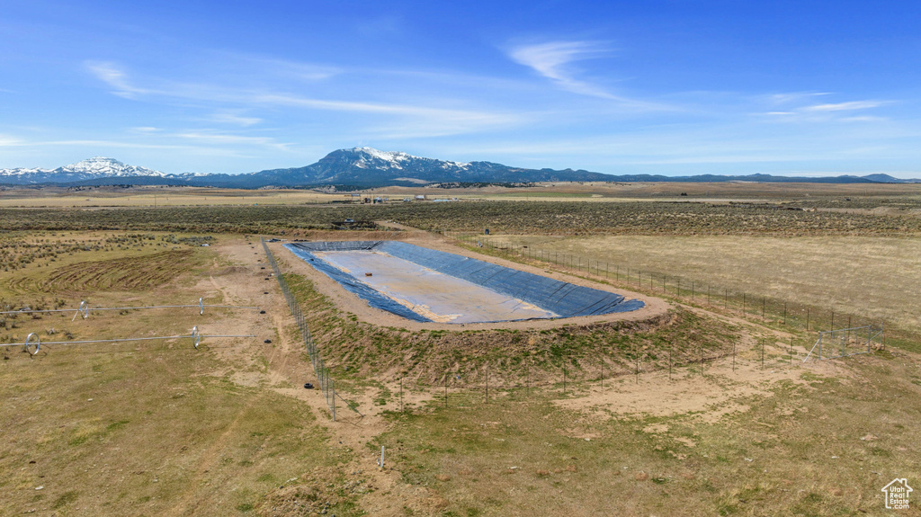 Overview of rural landscape featuring a mountain backdrop
