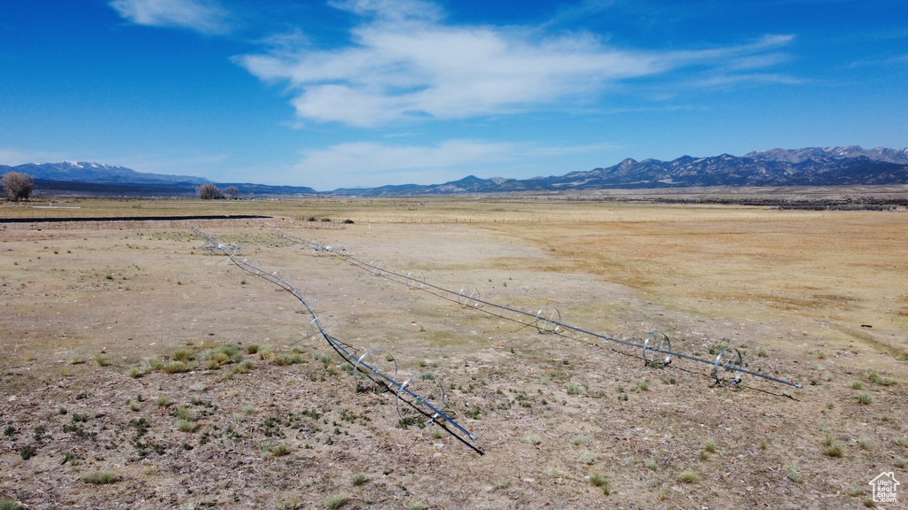 View of mountain background featuring rural landscape