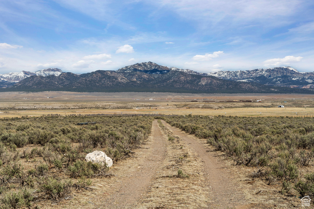 View of mountain backdrop with rural landscape