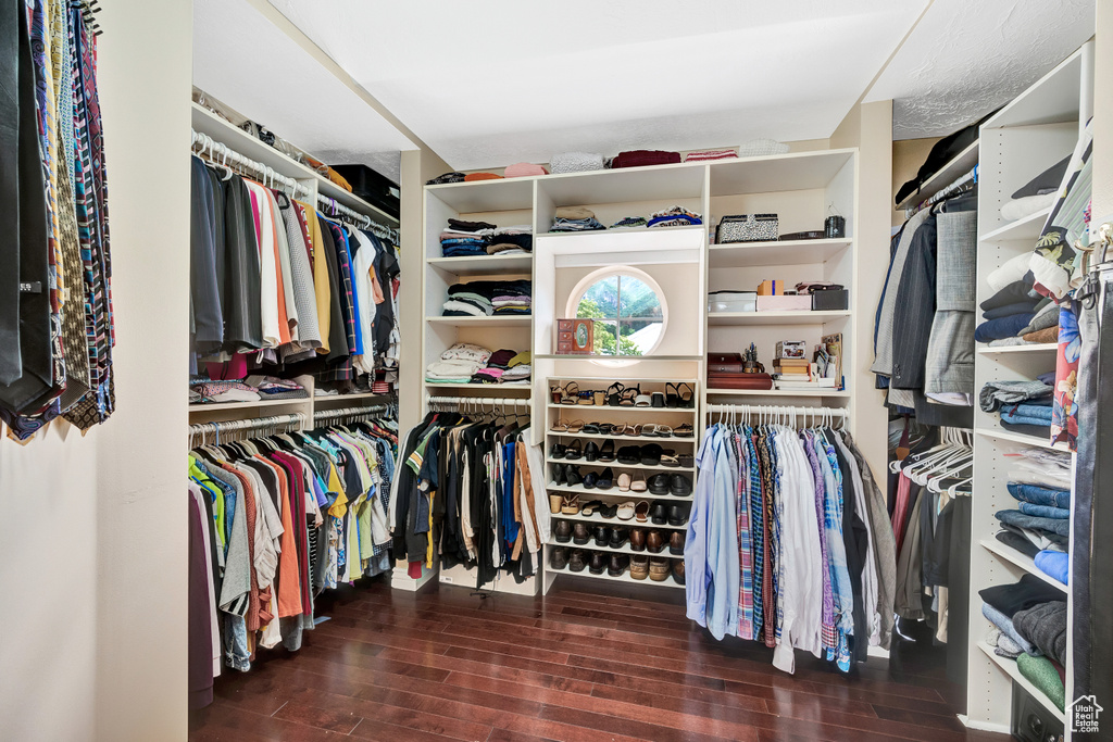 Spacious closet featuring wood finished floors
