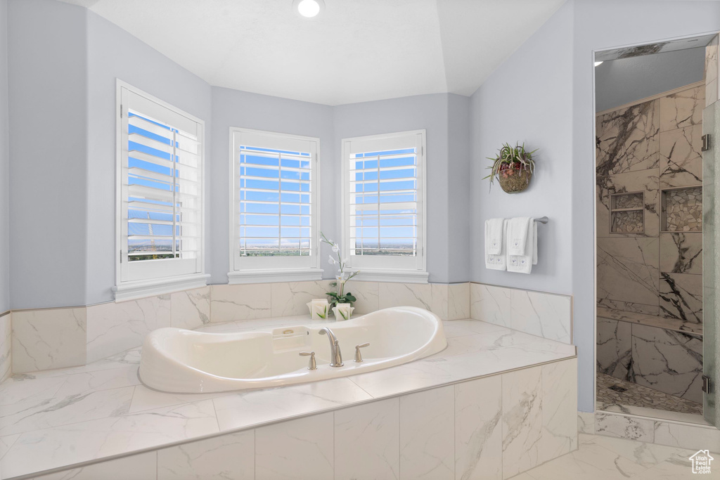 Full bath with a bath, a marble finish shower, and marble finish flooring
