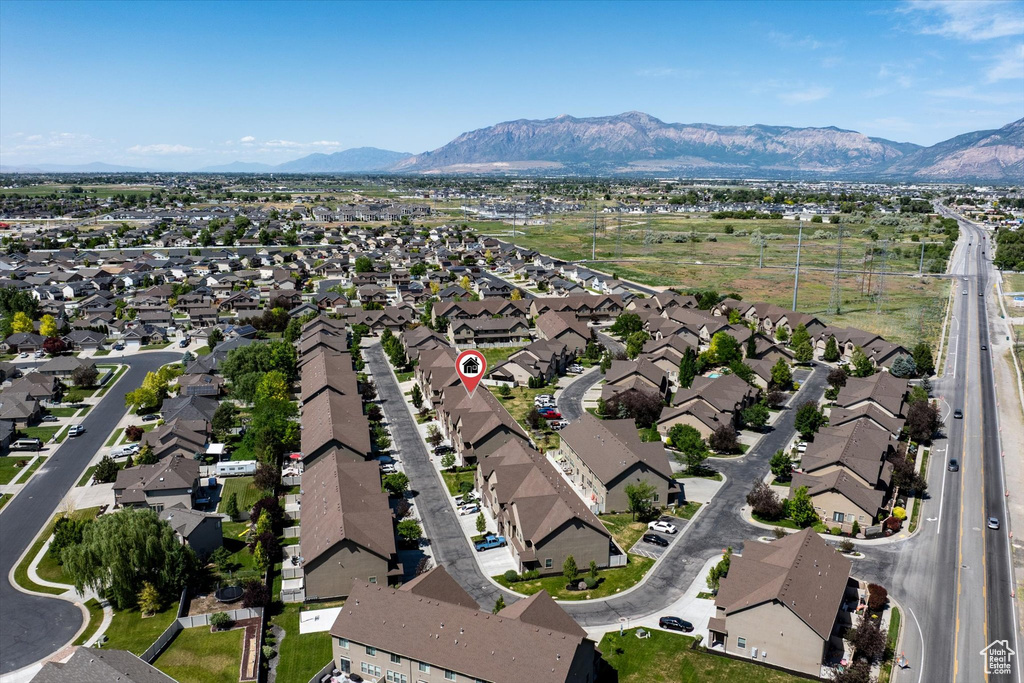 Aerial overview of property\'s location featuring nearby suburban area and mountains