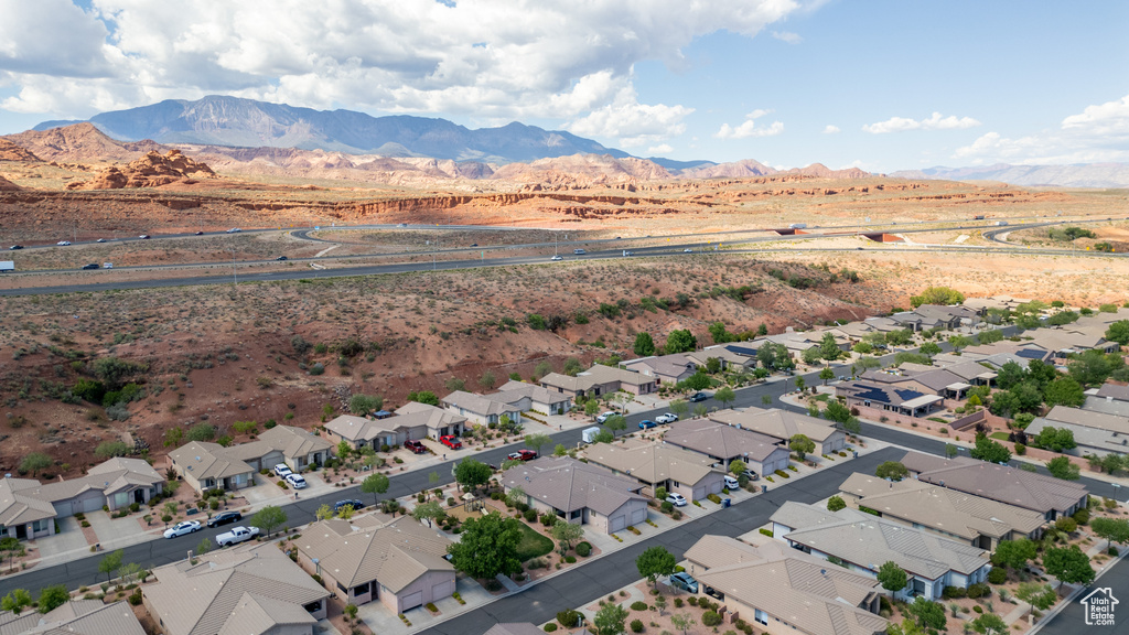 Aerial perspective of suburban area featuring a mountainous background