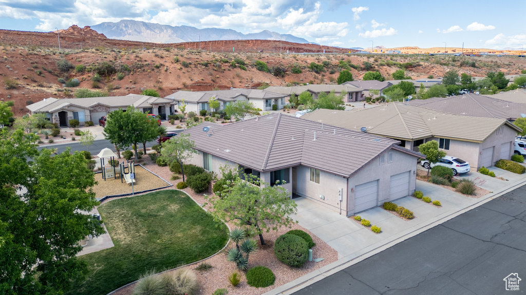 Aerial perspective of suburban area with a mountain backdrop