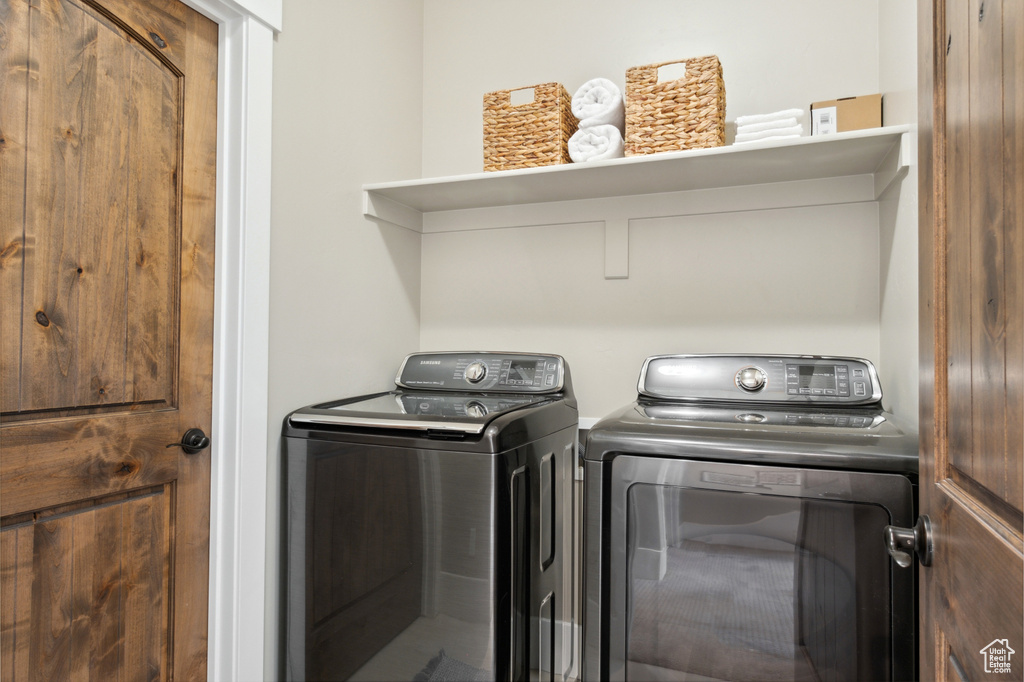 Laundry room with washing machine and dryer